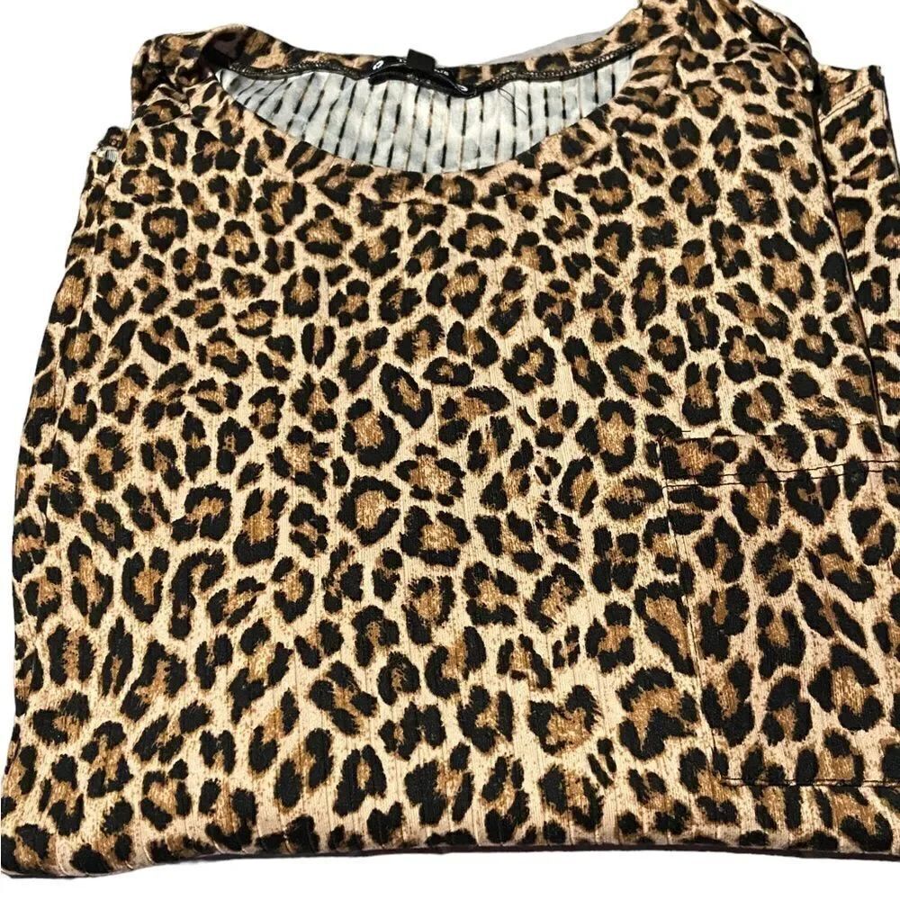 Try! This size 2X awesome leopard top cute pocket on right side great condition
